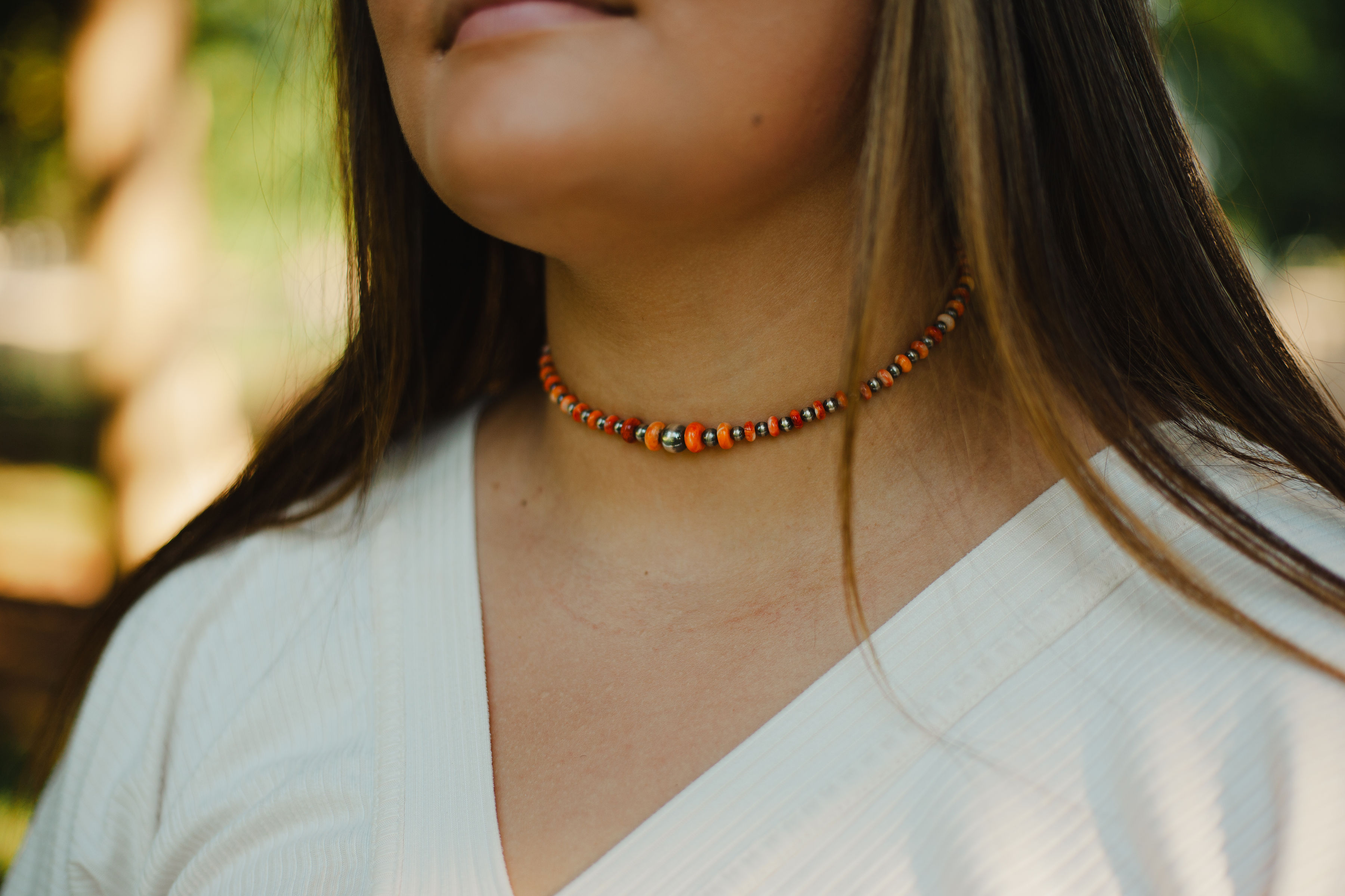 The Cowboy orange spiny oyster and silver game day necklace